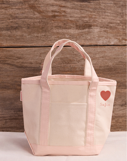 Icon embroidery on the side top of a tote bag